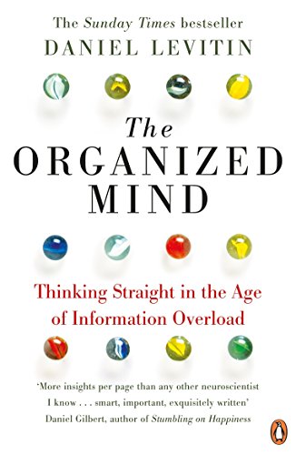 "Book cover for 'The Organized Mind' with marbles and text on a white background."