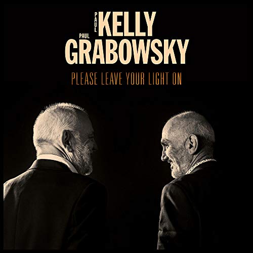 "Album cover with two older men facing away, against a black background."