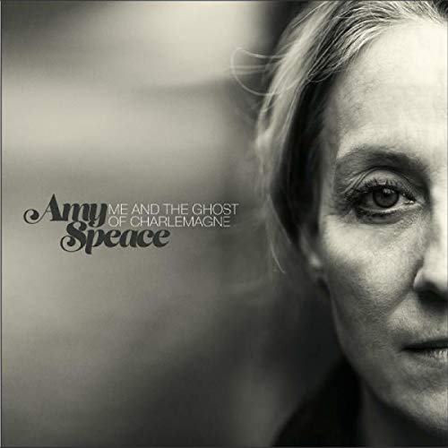 Black and white album cover with a close-up of a woman's face and artist's name.