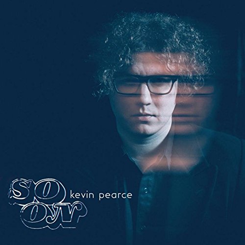 "Album cover with a black-and-white portrait of Kevin Pearce, wearing glasses and a dark jacket."