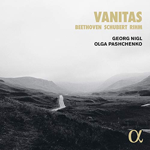 Black and white landscape album cover with gold text "Vanitas" and artist names.