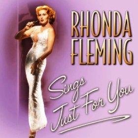 CD cover with Rhonda Fleming in a white dress, holding a microphone, on purple background.