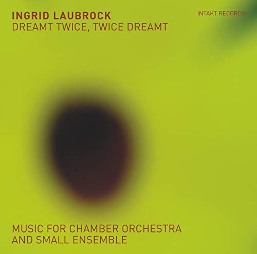 A lime-green album cover featuring a blurry, dark oval shape and red text.