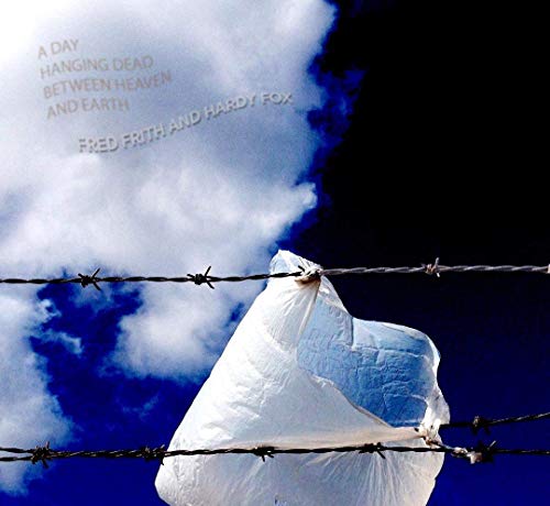 A white plastic bag caught on barbed wire against a cloudy blue sky.