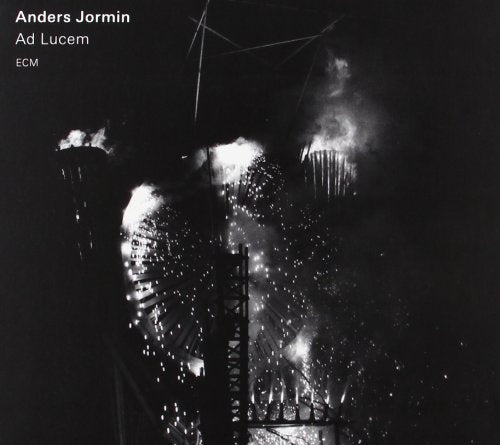 "Black-and-white album cover featuring a bridge lit by fireworks at night."