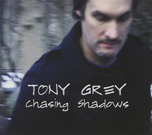 Album cover with a man in a dark shirt and the title "Chasing Shadows".