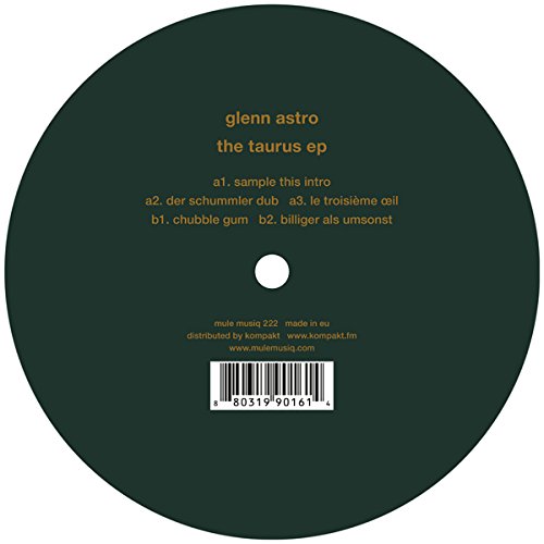 Dark green vinyl record with orange text and a barcode at the bottom.
