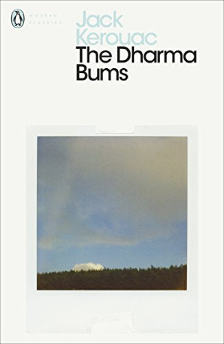 The image shows a book cover with a serene landscape. "White book cover with 'The Dharma Bums' title and mountain landscape image."