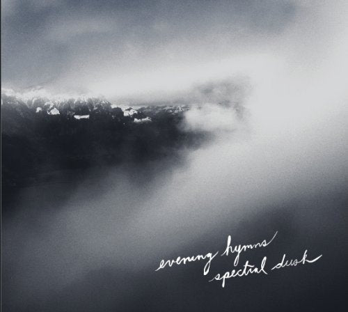 "CD album cover with black and white landscape image and white cursive text."