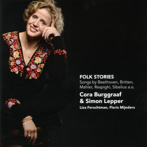 "CD cover featuring a woman with blonde hair, floral embroidery, against a black background."