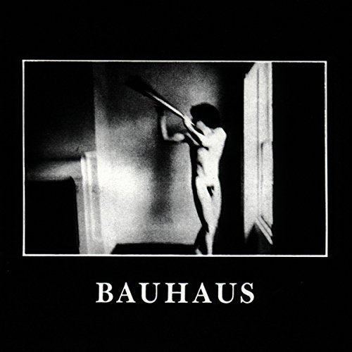 Bauhaus album cover featuring a black-and-white image of a person in a doorway.