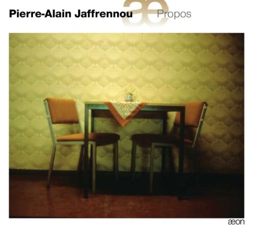 CD cover featuring a table with two chairs and a floral tablecloth.