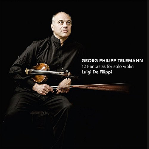 Man holding violin, seated, against black background, with white text on right side.
