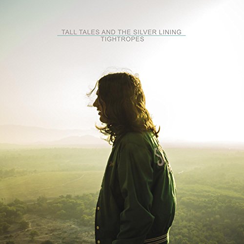 Album cover with a man standing in front of a green landscape.