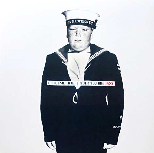 "Album cover featuring three men in matching uniforms and hats."