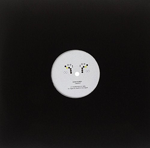 White vinyl record with colorful dots and text on a black background.