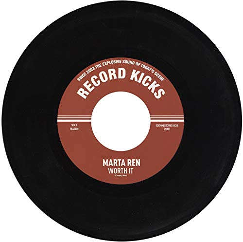 Black vinyl record with a red label featuring white text on a white background.