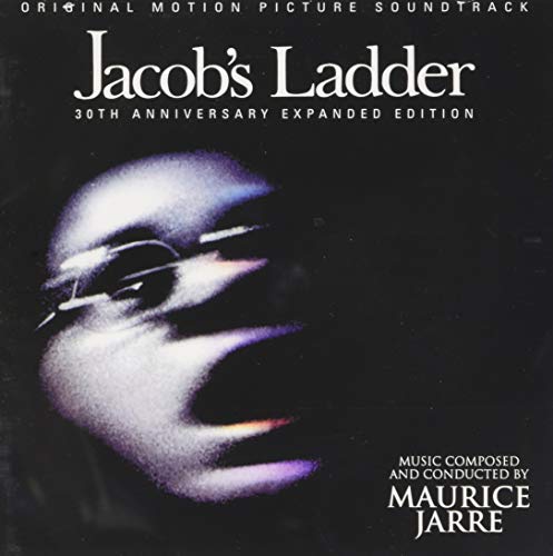 "CD cover with a close-up of a man's face, distorted and blurry, on a black background."