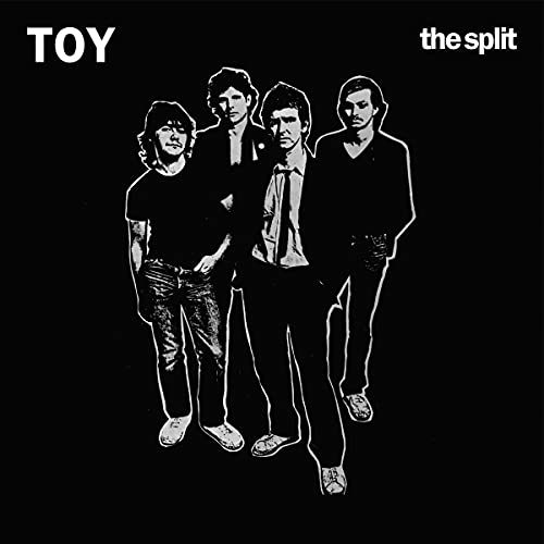 "Black album cover with white outline of four men and text 'TOY' and 'the split'."