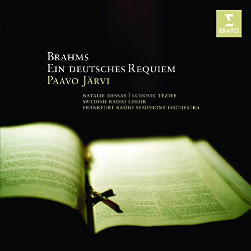 "CD cover with open book and cross on black background, featuring white text."