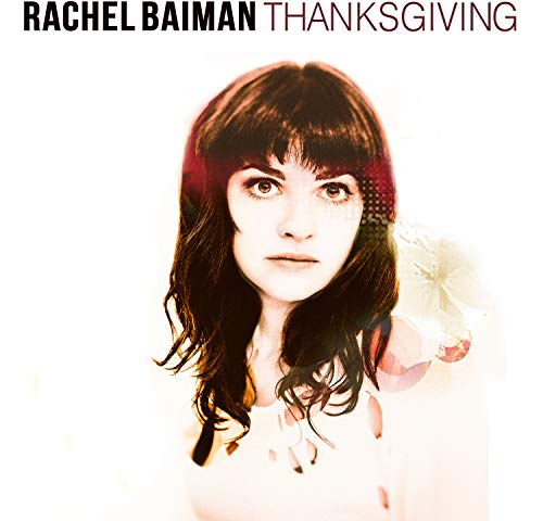 Album cover featuring a woman with long dark hair and bangs against a white background.