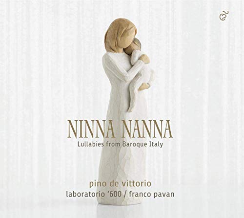 A wooden figurine of a mother holding a child, with text overlay on a white background.