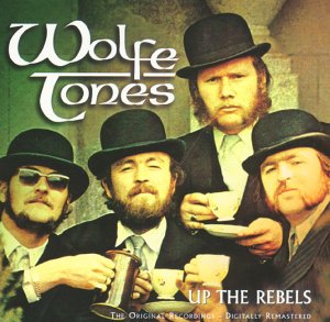 The image shows the CD cover for "Wolfetones - Up The Rebels". Alt text: Four men in black suits and hats on a CD cover.