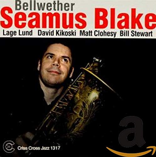 CD cover featuring a man holding a saxophone against a dark background.