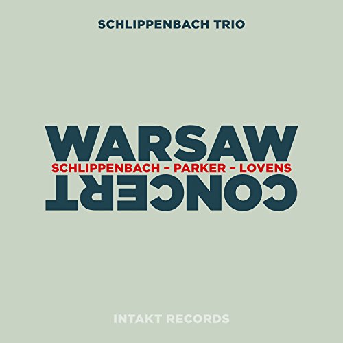 The image is a light green album cover with "WARSAW CONCERT" in large, dark blue, upside-down text.