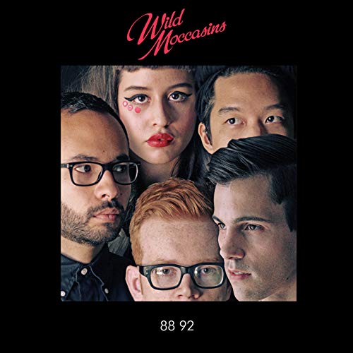 "Album cover featuring a close-up of five people looking down, on a black background."