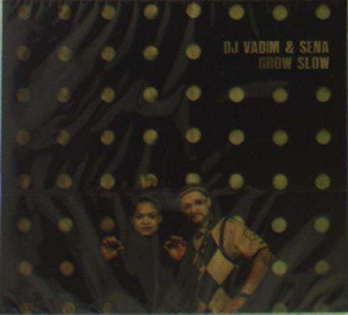 "Album cover with two people in front of a dark background with yellow dots."