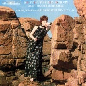CD cover featuring a woman in a black dress standing between rocky formations.