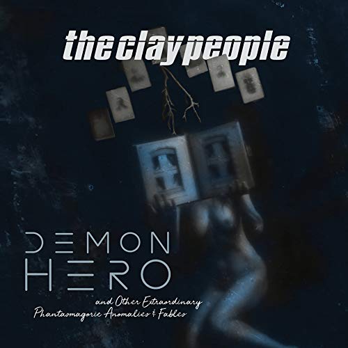 A vinyl record cover with a dark, blurry figure and Polaroid photos.