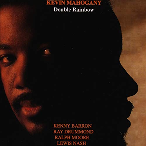 "Album cover featuring a man's face, half-lit and half-shadowed, with names listed below."