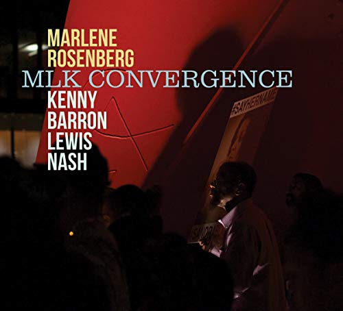 "CD cover with darkened image of people and red-lit wall, artist names overlaid."