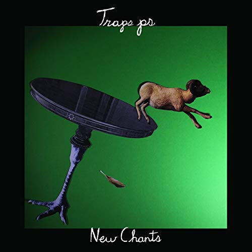 "Album cover with a lamb jumping off a turned over table on a green background."