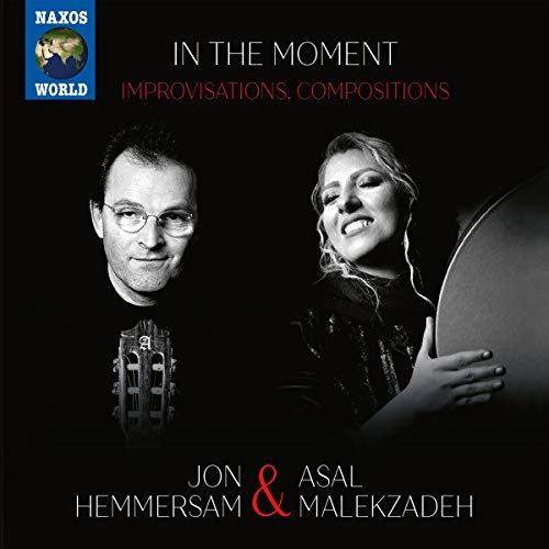 "CD cover featuring a man and woman holding musical instruments against a black background."