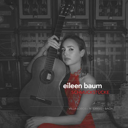 The alt text for the image is: "Woman in red dress holding an acoustic guitar."
