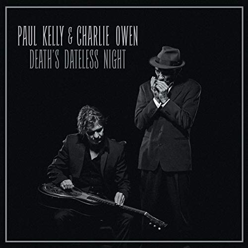 Black vinyl album cover with two men, one playing guitar, the other holding a harmonica.