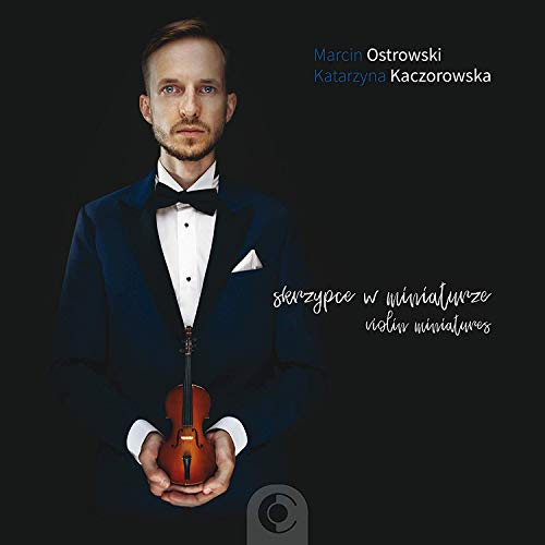 Man in tuxedo holding violin on CD cover with black background and white text.