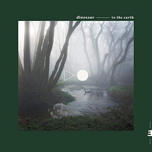 "Album cover with a misty forest scene and a dinosaur by a stream."