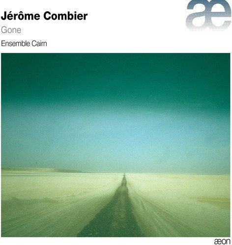 Album cover with a long, straight road in a vast, sandy landscape, fading to green.