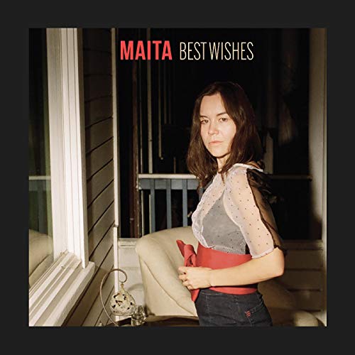 Compact disc album cover featuring a woman standing by a window at night.
