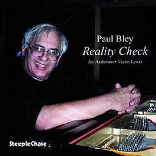 Paul Bley album cover with man playing piano, white text on black background.