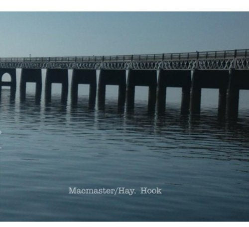 The alt text for the image is: "CD cover with a pier over calm water."