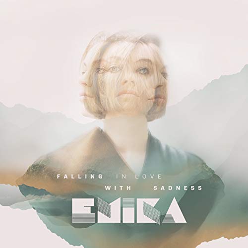 "Album cover with a woman's multiple exposed faces and 'Emika' text."