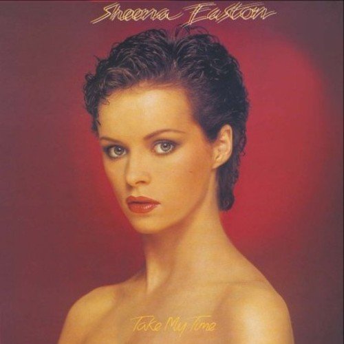 Album cover with a woman's portrait, red background, and artist's name at the top.