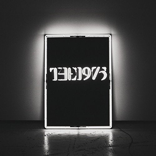 A vinyl record sleeve with inverted white text "the1975" on a black background.