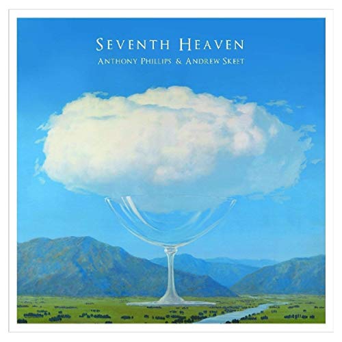 "CD case with booklet and four discs, all featuring a cloud design."