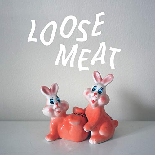 The image shows two pink rabbit salt and pepper shakers. "Two pink ceramic rabbit salt and pepper shakers on a white surface."